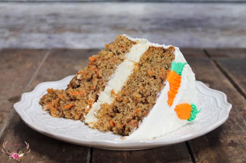 If you love carrot cake and cheesecake then this Carrot Cake Cheesecake cake is just what you need. This cake is made of 2 moist layers of carrot cake and one delicious layer of cheesecake in between and smothered with cream cheese frosting.