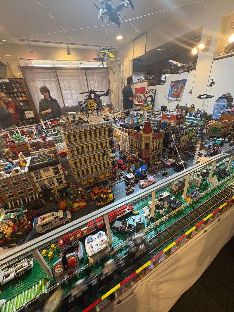 A LEGO Shop With A Huge Town And Working Train Display
