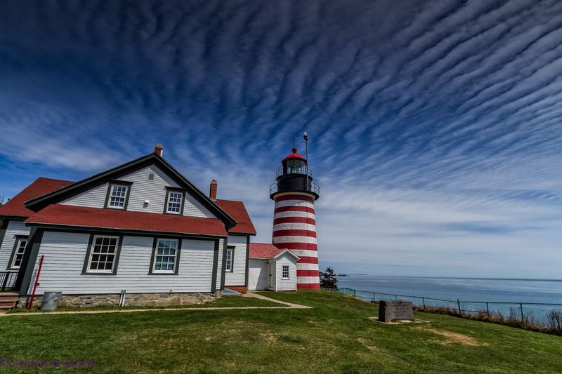 A Lighthouse Dressed In Peppermint Stripes