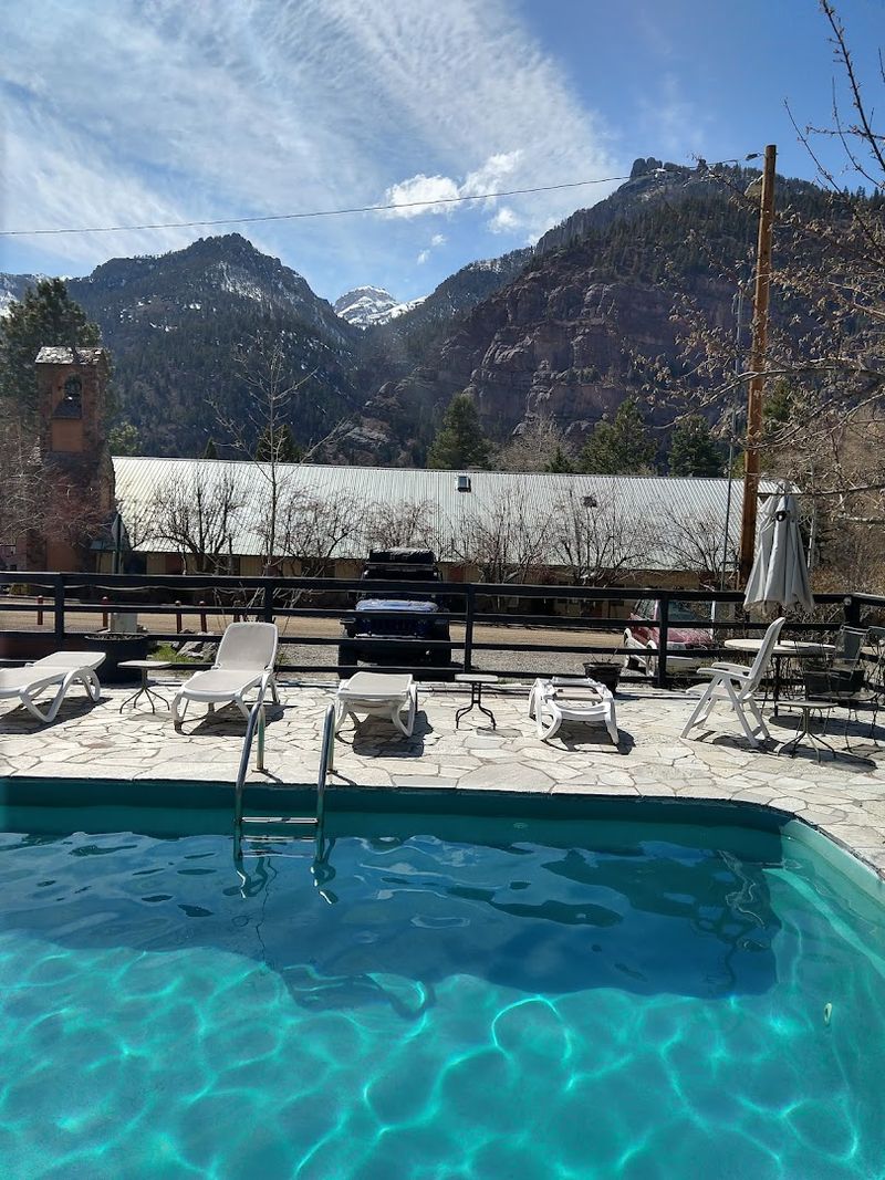 The Outdoor Pool And The Mountains Playing Backdrop