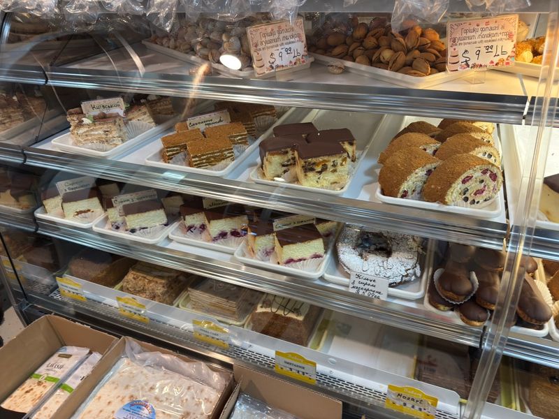 A Pastry Case Stacked With Napoleon, Honey Cake, And More