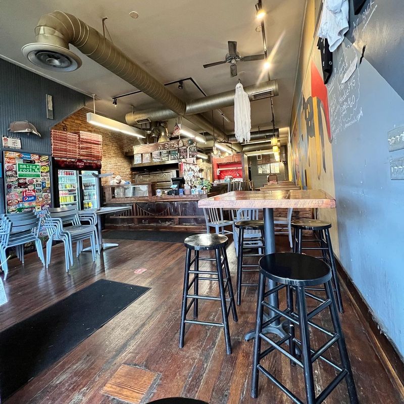 A Room With Booths, Brick, And Zero Pretense