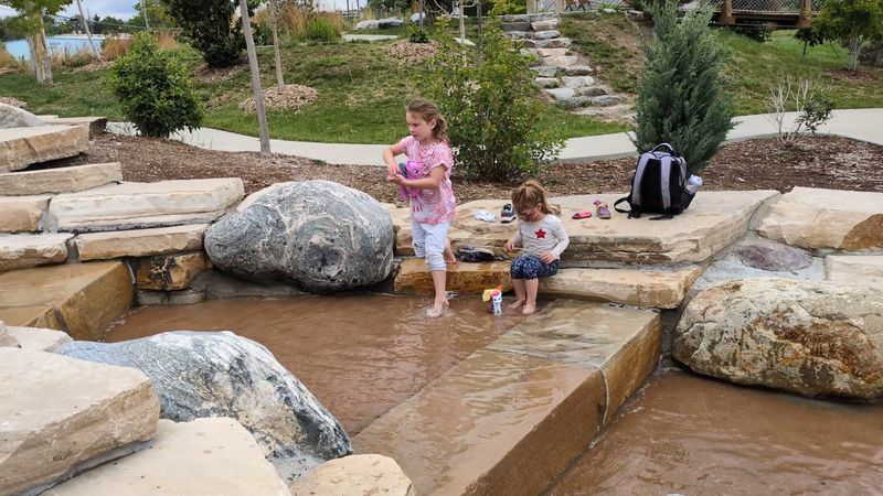 A Sand Pit With Running Water And Buried Surprises
