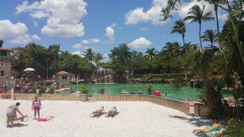 A Sandy Beach Area Right Next To The Pool