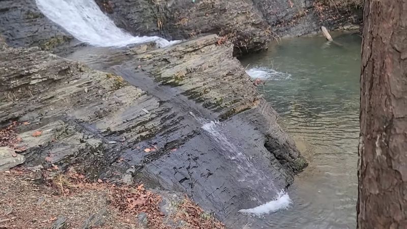 A Small Waterfall With A Calm Presence A Small Waterfall With A Calm Presence