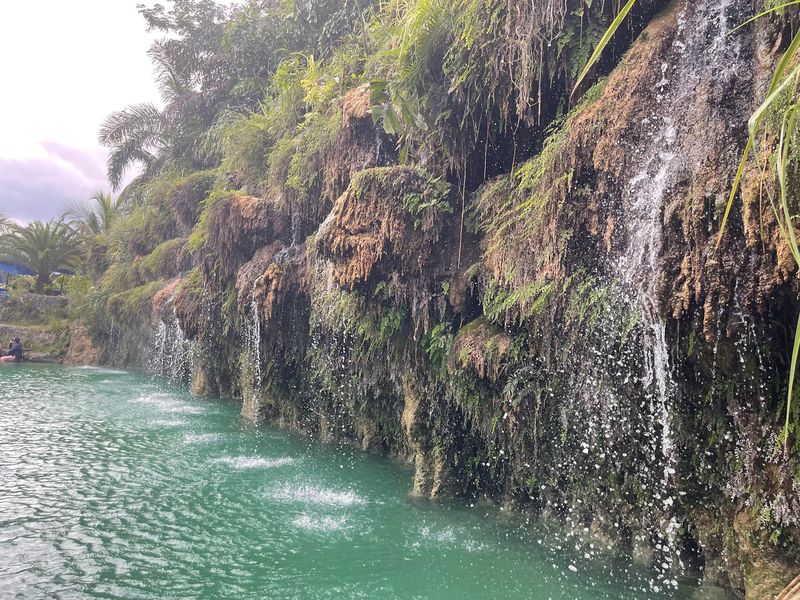 A Spring-Fed Lagoon With Cascading Rock Walls A Spring-Fed Lagoon With Cascading Rock Walls