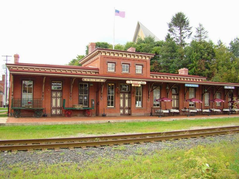 A Stone Hotel And A Train Station Share The Spotlight