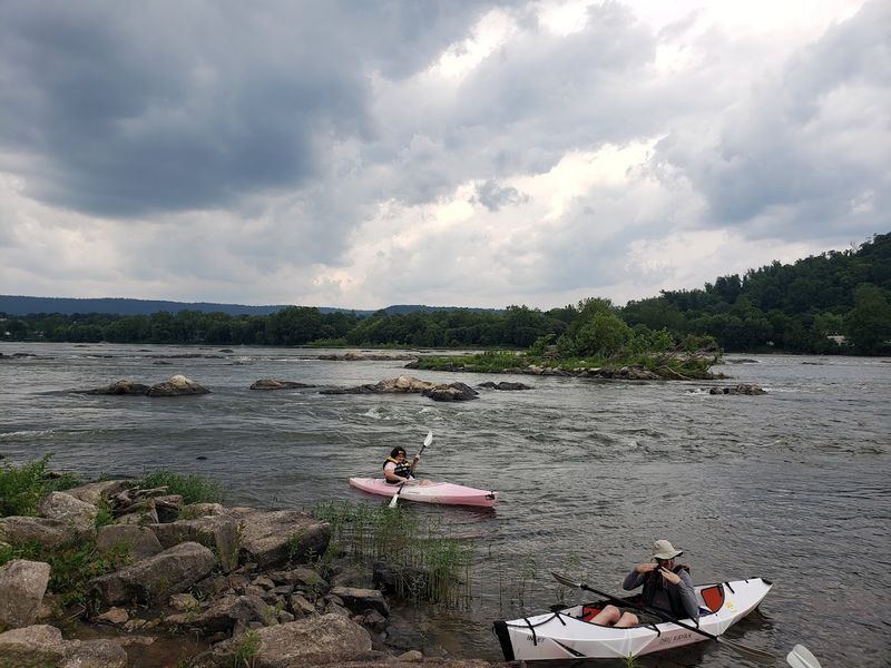 The Kayaking Scene Around Her