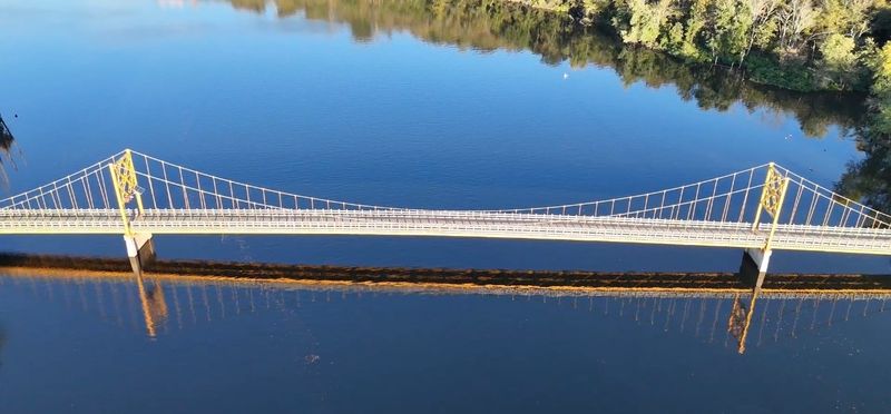 A Vintage Bridge Framed By Hills