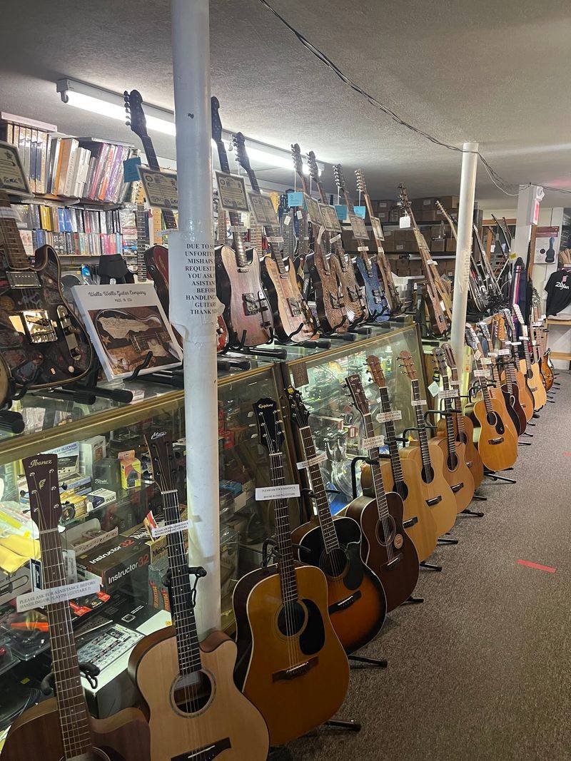 A Wall Of Guitars And Instruments