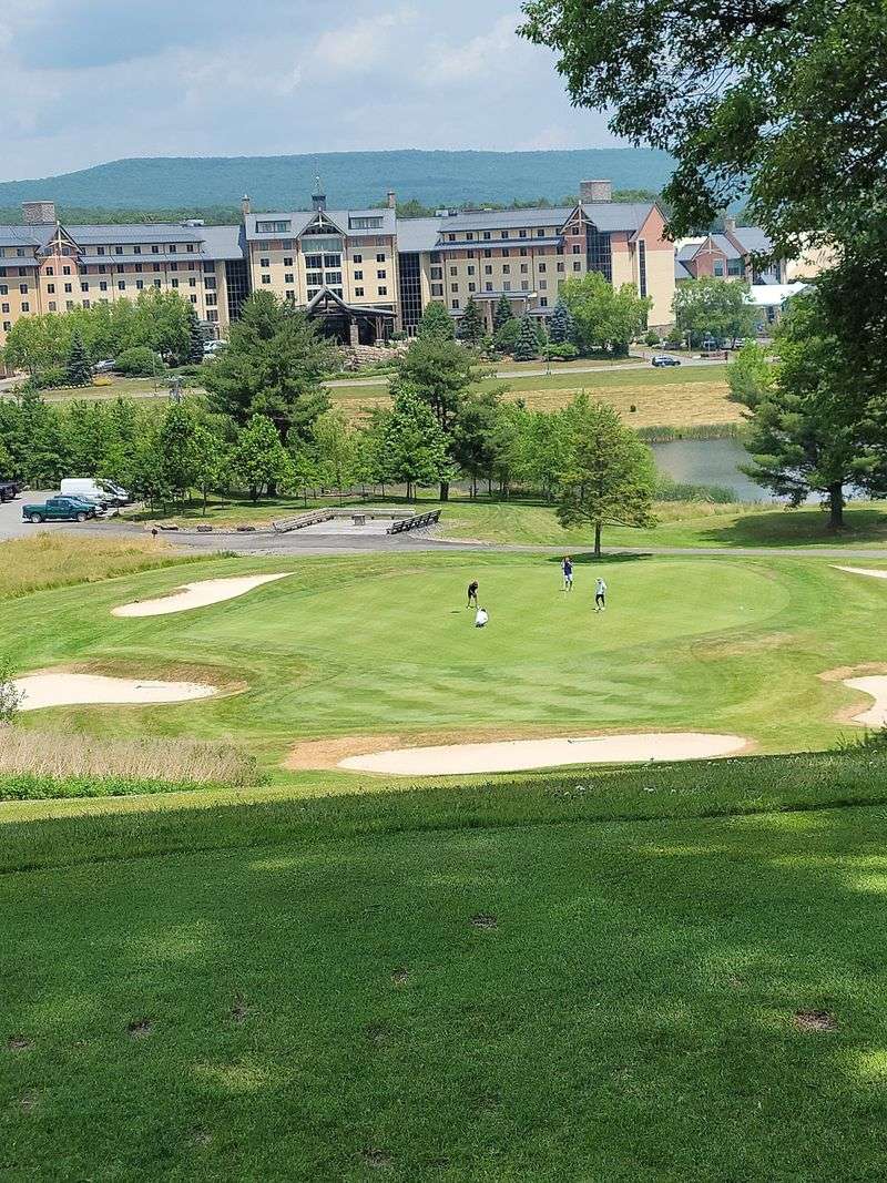 An 18-Hole Golf Course Beside A Lake