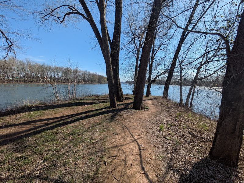 An Island Park Sitting In The Middle Of A River