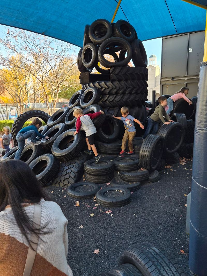 An Outdoor Playground With Tire Towers An Outdoor Playground With Tire Towers