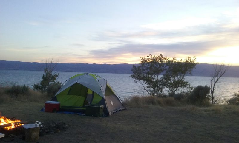 Camping Under Mountain Stars Right At The Water's Edge