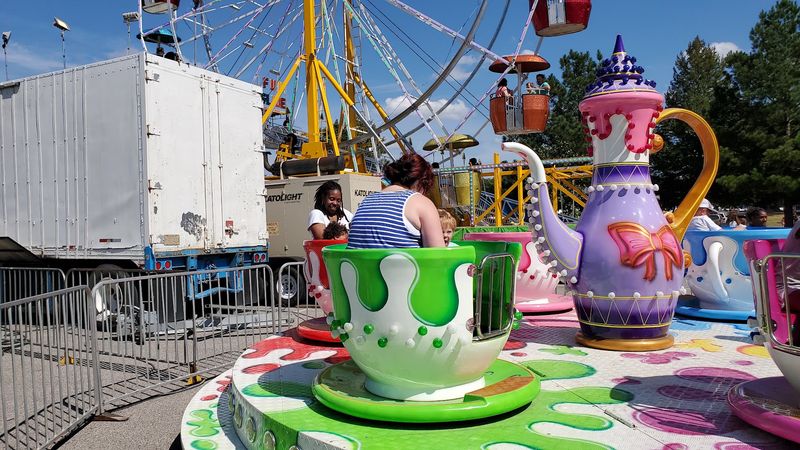 Carnival Rides Fill The Open Fairgrounds