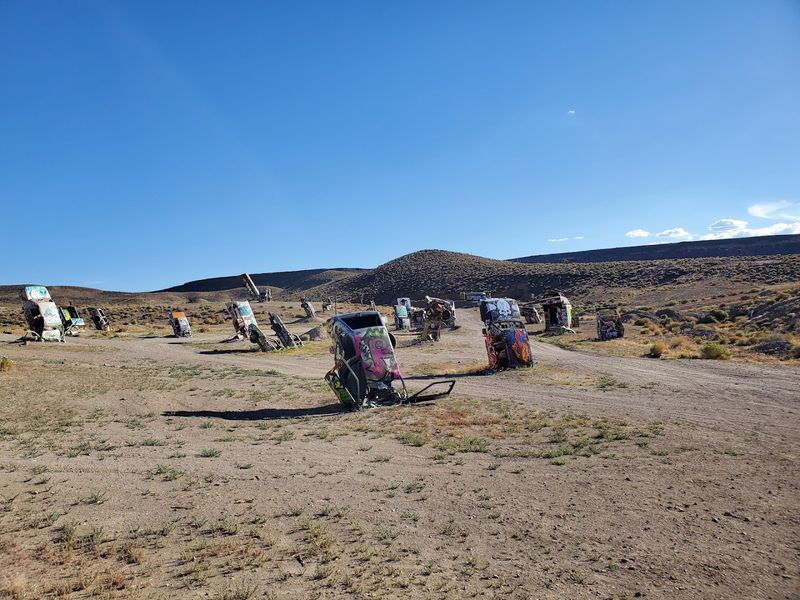 Cars Buried Nose-First In The Desert Ground