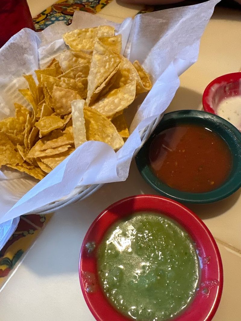 Complimentary Chips, Queso, And Salsa Verde That Set The Tone
