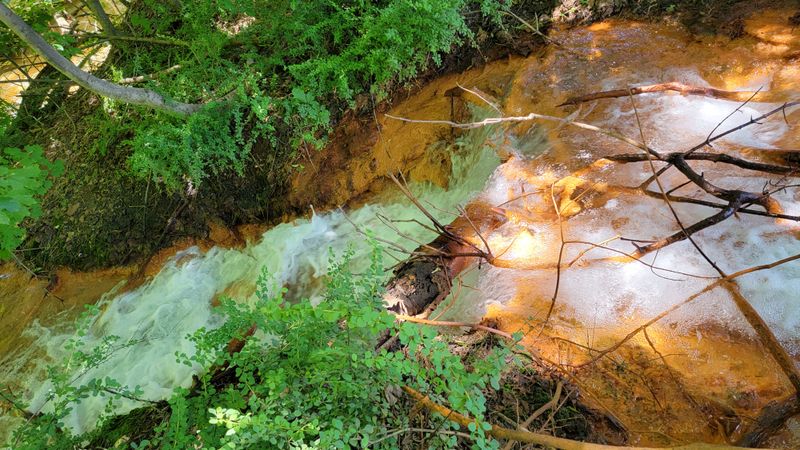 Orange Mineral Deposits Create Alien Landscape