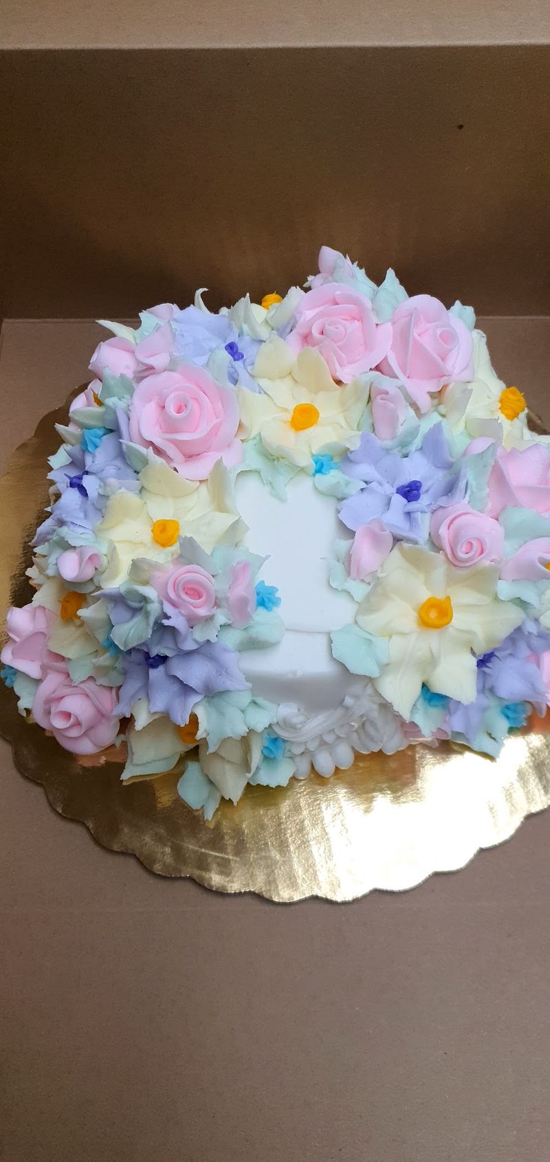 Custom Cakes With Frosting Flowers In Full Bloom