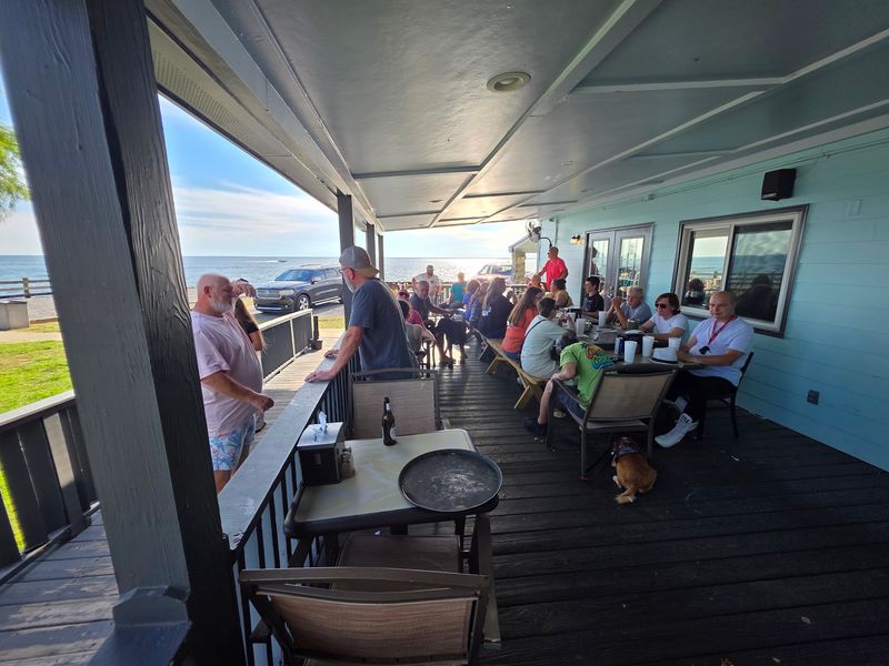 Easygoing Decor And A Covered Deck On The Water