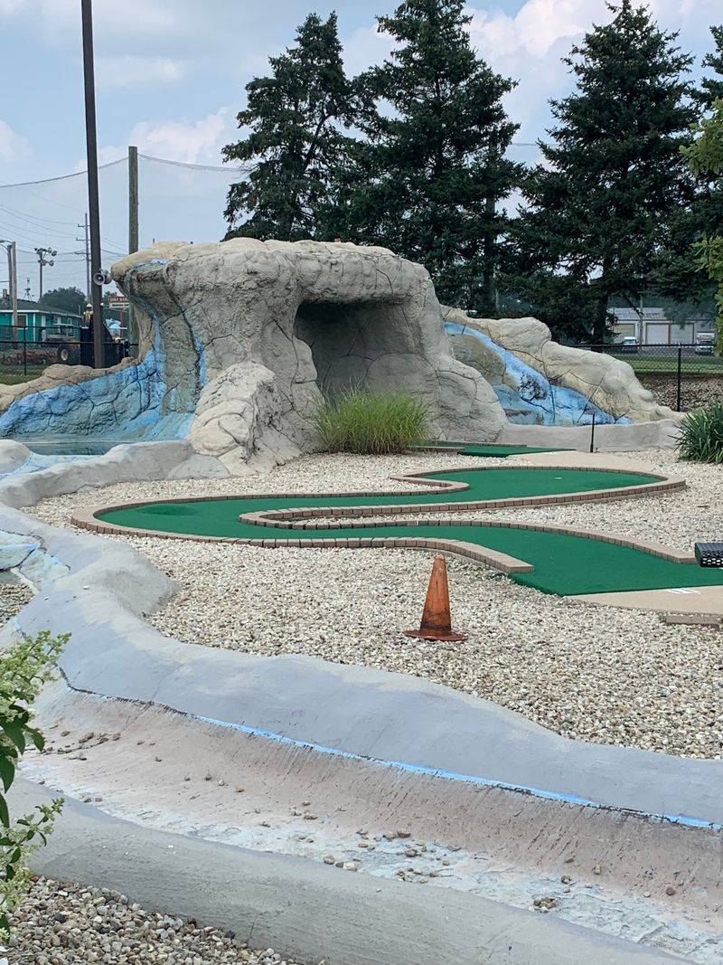 Eighteen Holes Beside A Waterfall