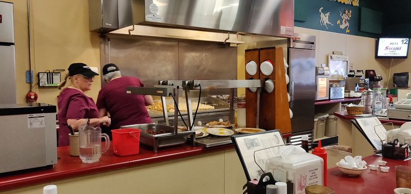 Family Hands Behind The Counter