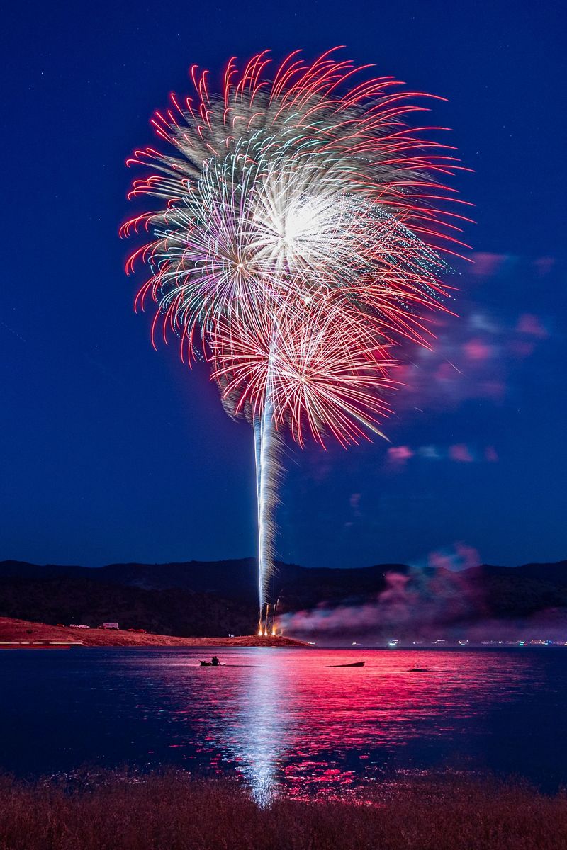 Fireworks Burst High Above The Lake