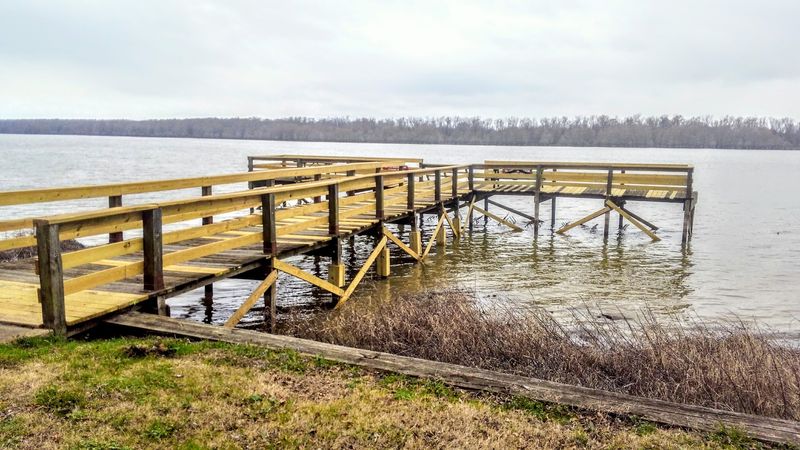 Fishing Piers Reach Into The Calm Lake