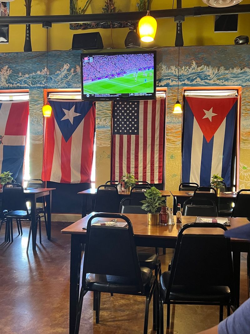 Flags, Salsa Music, and Dominoes at the Table