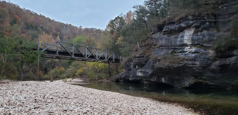 Forested Banks Rise Around The Swimming Area