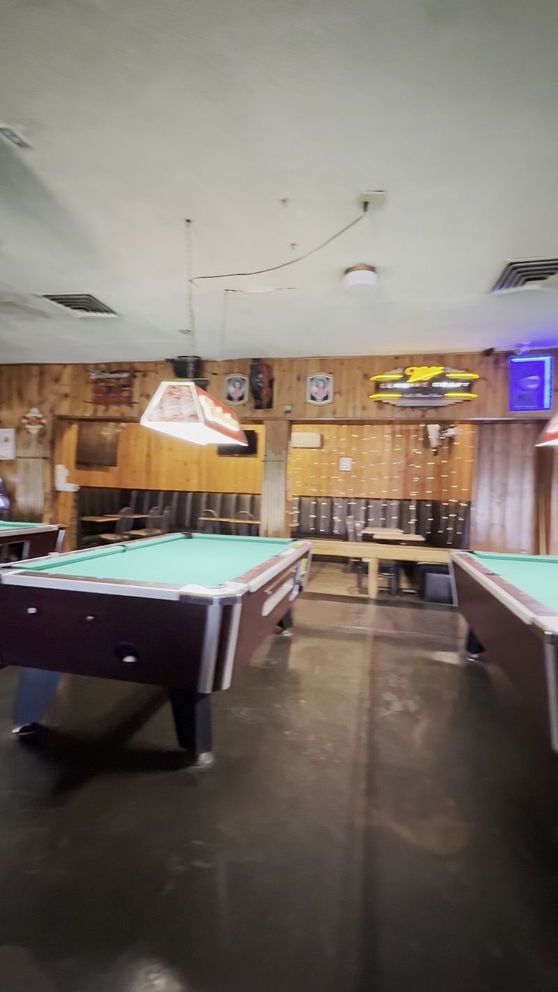 Four Pool Tables And A Room Full Of Screens
