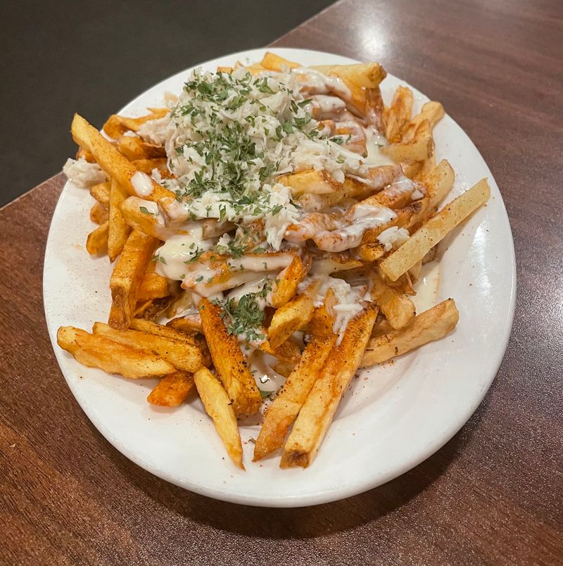 The Famous Loaded Fries Topped With Crab and Cajun Seasoning
