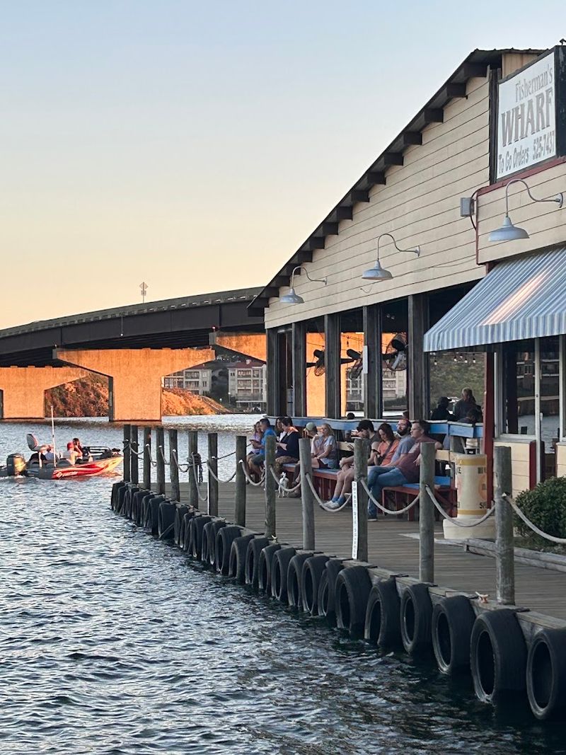 Sunset Dining With Boats Drifting By
