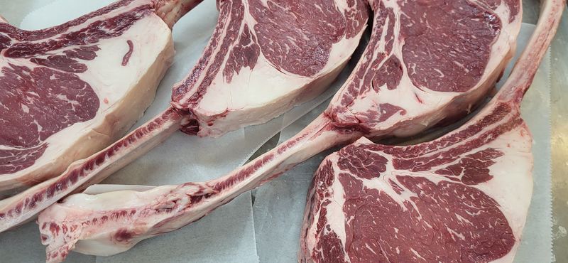 Fresh-Cut Tomahawk Steaks And Prime Ribeyes At The Counter