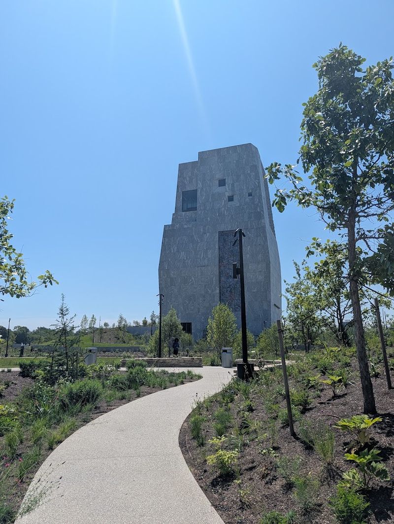 Gardens, lawns, and walking paths that carry the visit