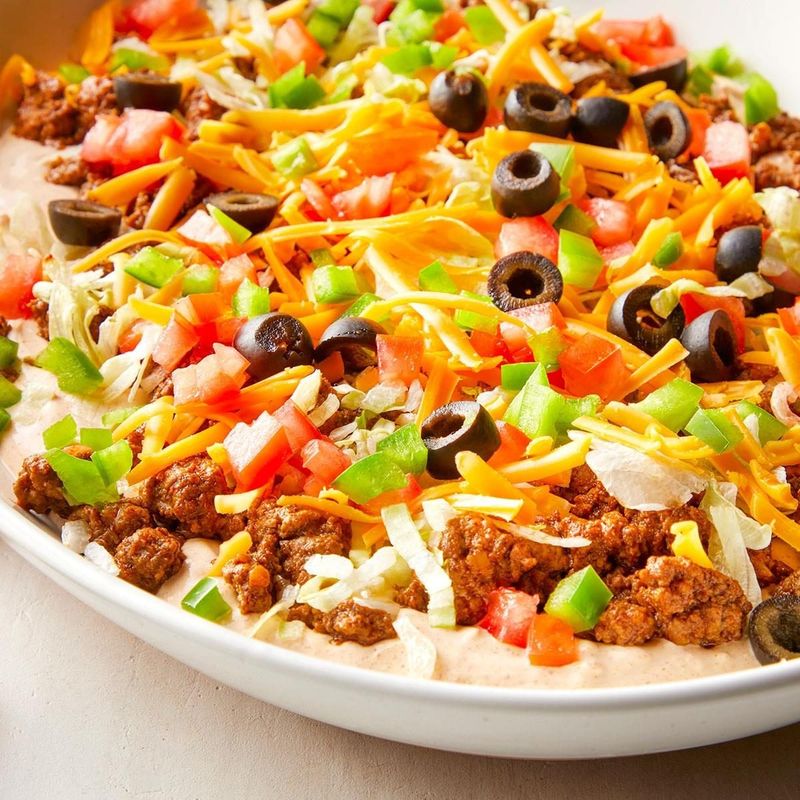 Taco Dip with Doritos: The Party Starter Everyone Crowds Around