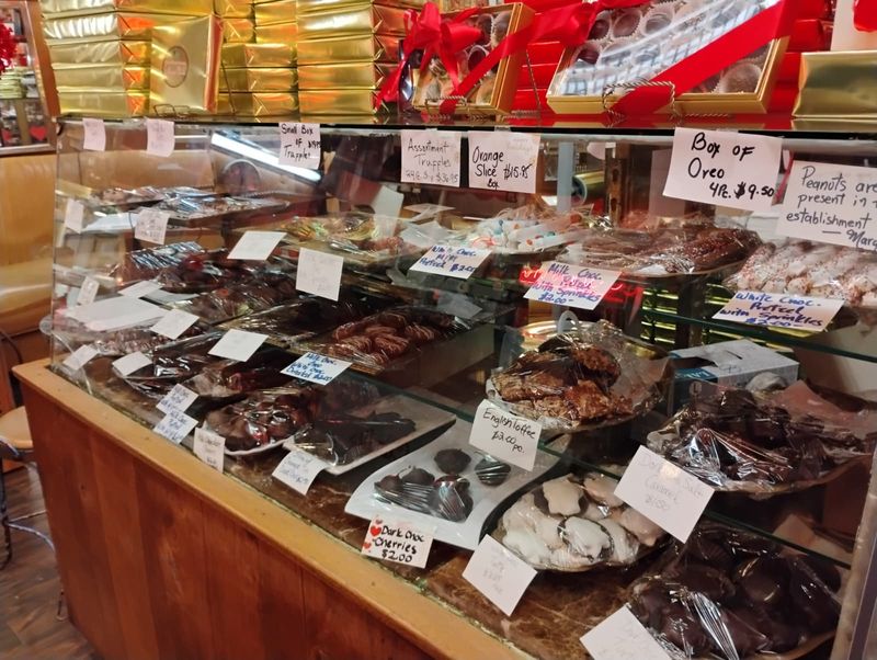 Glass Cases Full Of Hand-Dipped Chocolates Glass Cases Full Of Hand-Dipped Chocolates