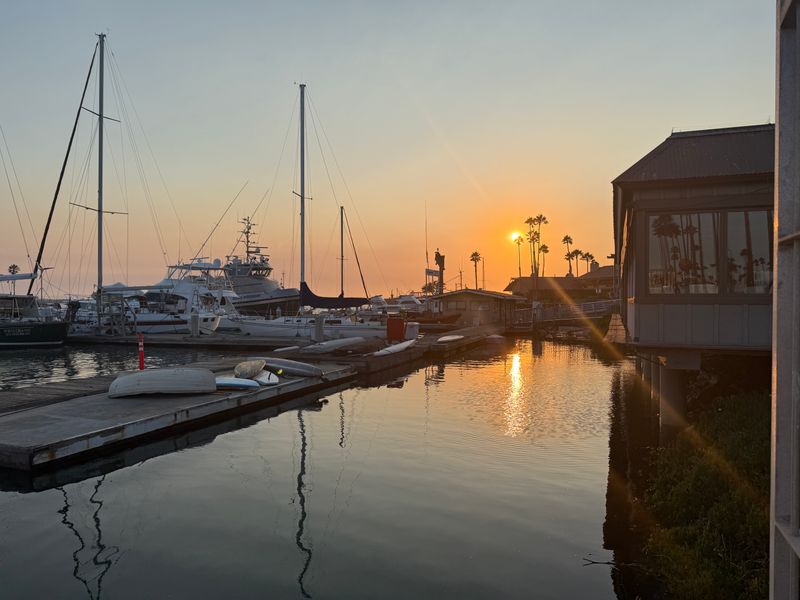 Sunset Gathering At The Water’s Edge Before The Countdown