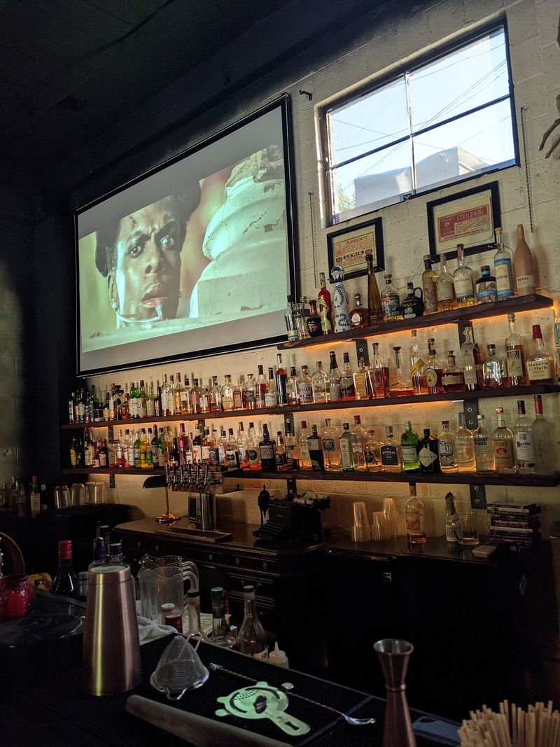 Horror Films Glowing Behind The Bar