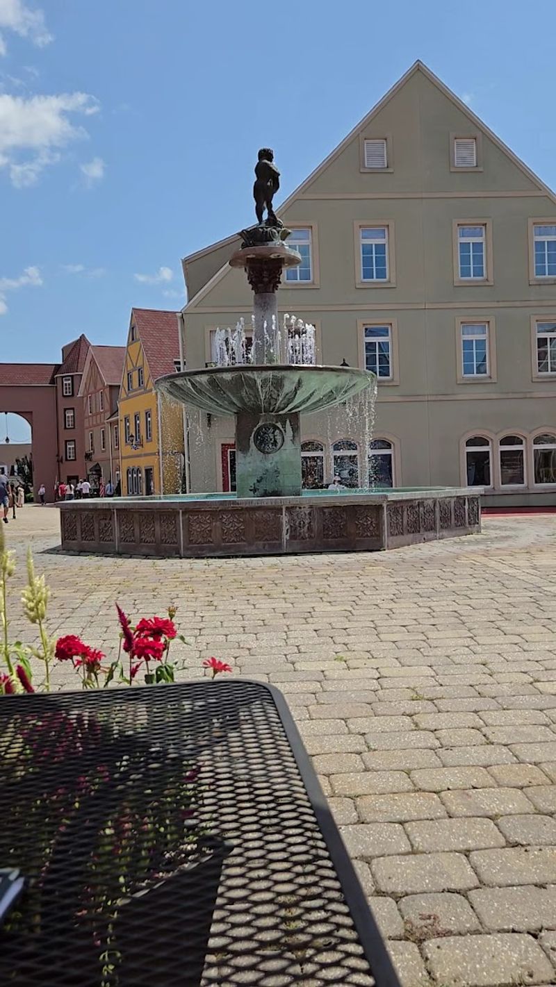 Outdoor Seating Next To A Fountain Is A Real Perk