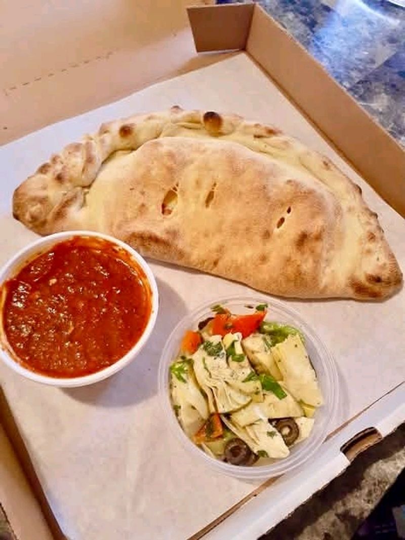 Calzones Stuffed To The Brim With Ricotta And Toppings