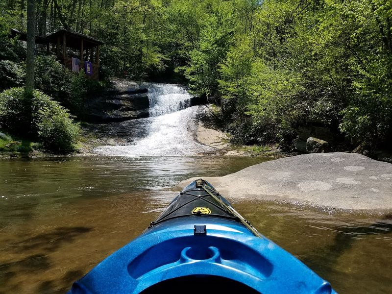 Kayaking And Paddle Boarding On Glassy Mountain Water