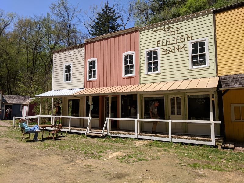 Log Cabins And Old Main Street Storefronts