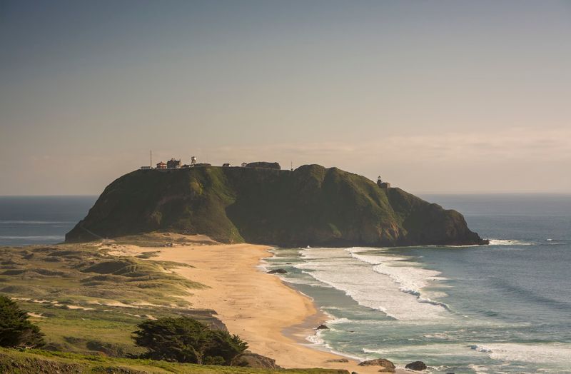 Point Sur Lighthouse Standing Watch Over The Wild Coast