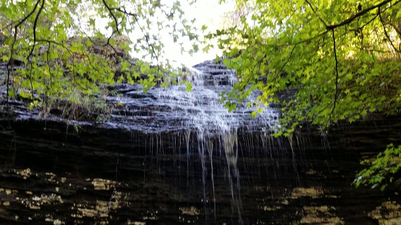Mossy Rocks And A Curtain Of Water