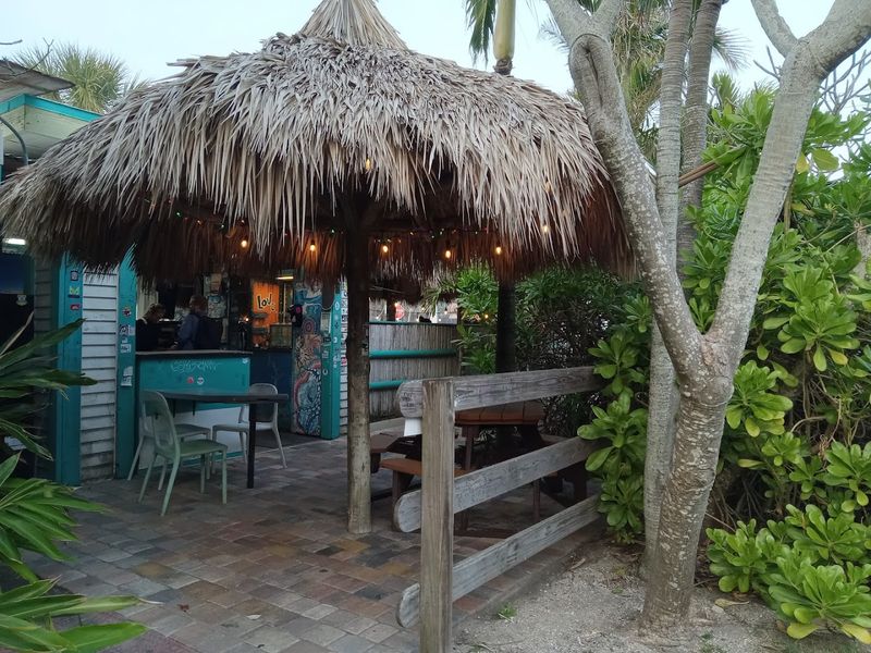 Outdoor-Only Seating Under Shady Tiki Huts Outdoor-Only Seating Under Shady Tiki Huts