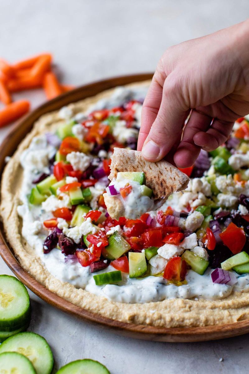 Wilted Salad vs. Hummus And Veggie Plate With Pita