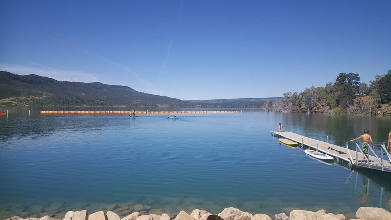 Paddle Boarding And Kayaking On Surprisingly Calm Mountain Water