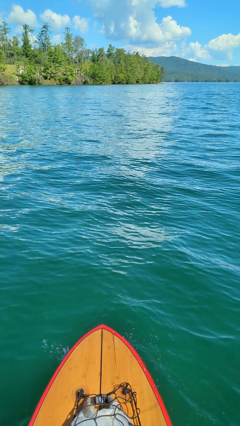 Paddleboarding And Kayaking On Glass-Smooth Water