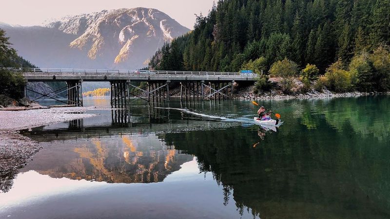 Paddling Across Glassy Blue Water